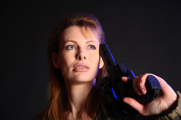Portrait of the blonde with gun