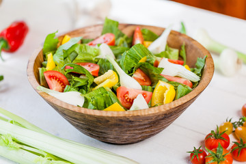 vegetable salad bowl on kitchen table, balanced diet