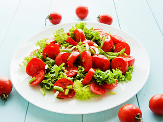 Cherry tomatoes and greens