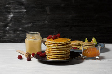 Fluffy cottage cheese pancakes with honey, jam, yogurt and fresh fruit