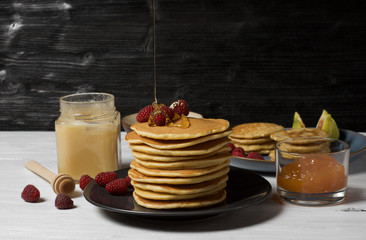 Fluffy cottage cheese pancakes with honey, jam, yogurt and fresh fruit