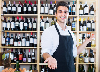 seller standing in alcohol section