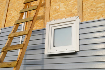 siding covering the wall of a house under construction