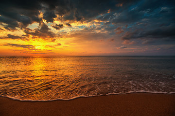 Naklejka na ściany i meble Beautiful sunrise over the sea