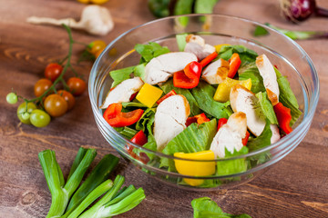 chicken salad bowl on kitchen table, balanced diet