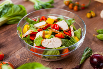 chicken salad bowl on kitchen table, balanced diet