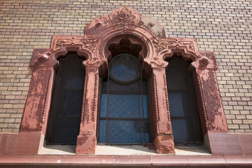 Beautiful stucco molding window on the facade of the church