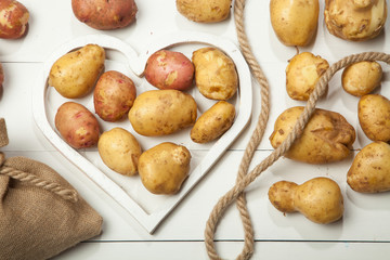 Potatoes in the heart on a white background