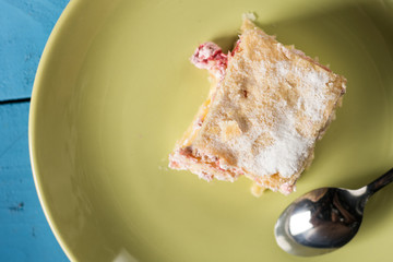 Flat lay above cream pie with raspberry in the moody light