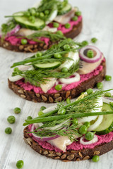 Sandwich with herring, horseradish and fresh herbs.