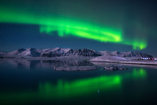 Northern lights over the glacier lagoon Jokulsarlon, Iceland