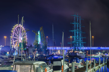 MARINA AT NIGHT - Yachts and sailing ship Mir moored at the wharf of the marina in Szczecin - obrazy, fototapety, plakaty