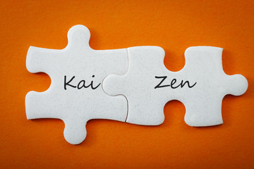 Business concept and interconnected puzzle pieces that put the words “kai” meaning 