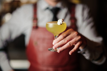 bartender hands with cocktail on the bar stand