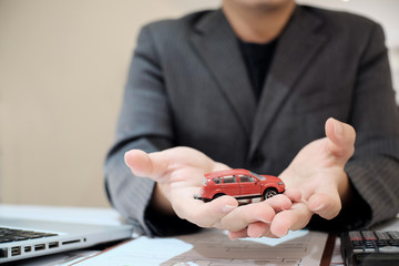 Sale man agent present a car in showroom, sale car concept.