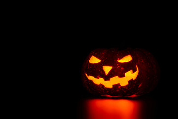 Spooky pumpkin with candle insight