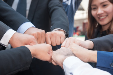 Business people show their fists, team work work together concept.