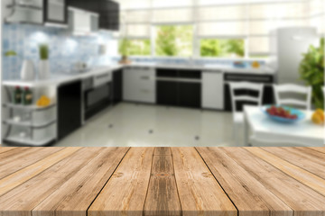 Empty light wood table top with kitchen  background. Leave space for placement you background - can be used for display or montage or mock up your products.