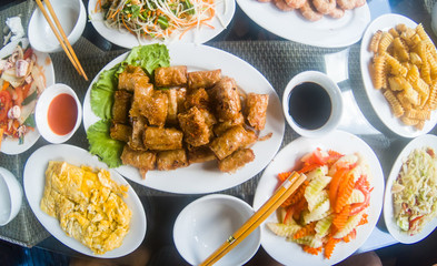 vietnamese food on table, spring rolls, eggs, shrimps