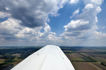 Fototapeta na wymiar View from the plane window at low altitude.