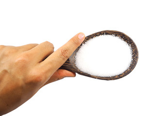 White sugar in wooden spoon in woman hand