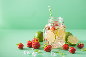 refreshing summer lemonade with strawberry and lime in mason jar