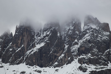 Cloudy snowy mountains peaks landscape. Dolomites Alps
