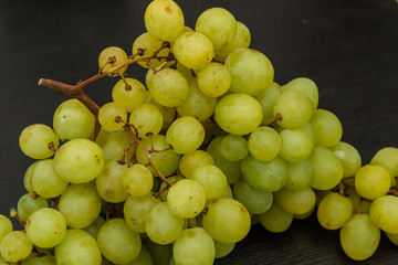 Sultana grape on the dark grey kitchen table