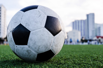 Fototapeta premium Soccer Football on the green grass of Soccer field.