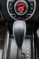Obraz na płótnie Canvas Closeup gear stick driving car. interior of modern car .
