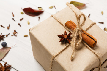 Winter background with present box on white wood