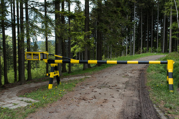 Iron Barrier on the border of the state in the forest. 