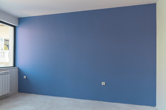 Unfinished interior of apartment  under construction. Gray concr