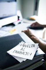 man at office and text back to work in spanish