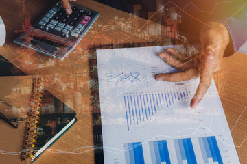 Double exposure of financial and offshore oil and gas platform background concept.  Hand business...