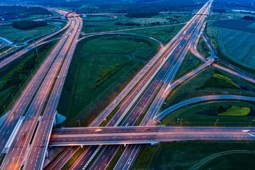 Aerial view on evening traffic on motorway junction