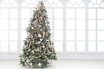 Beatiful christmas decorated tree in shining lights