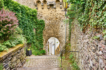 Portal of Stronghold in valley of Moselle  / Entrance gate through defending wall of historical city of Cochem in Germany