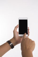 Isolated image of hands holding mobile phone and touching screen on white background