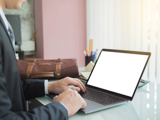 Close-up of male hands businessman using modern white screen laptop in home