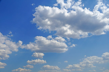 White fluffy clouds in the blue sky.