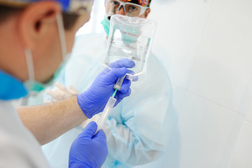 surgical dripper closeup on the background of the surgeons