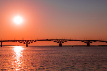 Sunrise over a road bridge across the Volga river between the cities of Saratov and Engels, Russia.