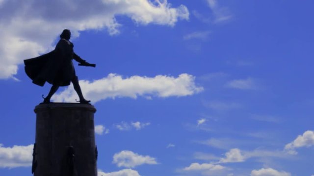 Statue of Peter the Great walking with a scroll in hand