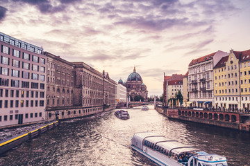 beautiful spree river with boats and berlin dom in the background