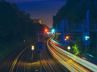 train rails at night with long exposure lights