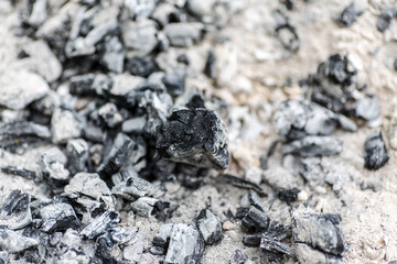 Many burned embers, abstract background, selective focus