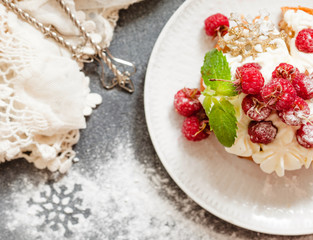 Raspberry Cake with whipped cream on pink background