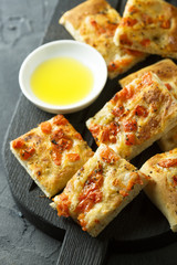 Homemade bread with tomatoes, herbs and olive oil