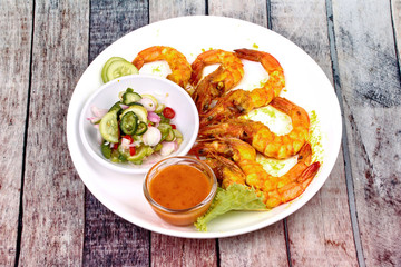 Charcoal boiled ,Prawn satay served with side disk.
